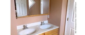Bathroom with double vanity and large medicine cabinet