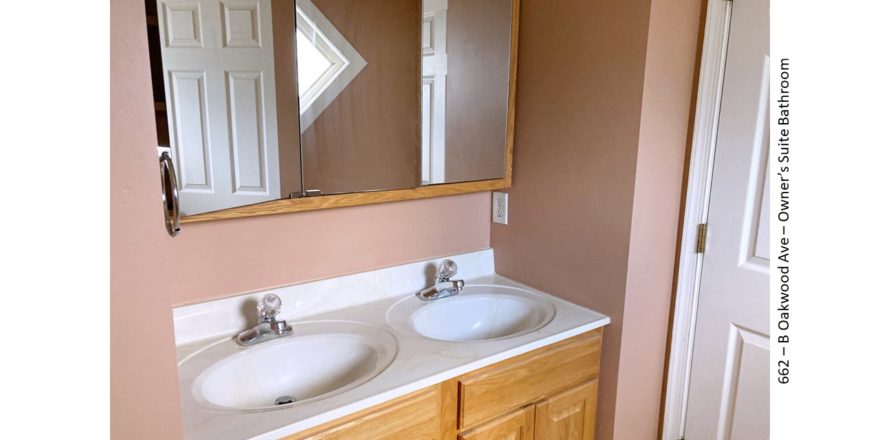 Bathroom with double vanity and large medicine cabinet