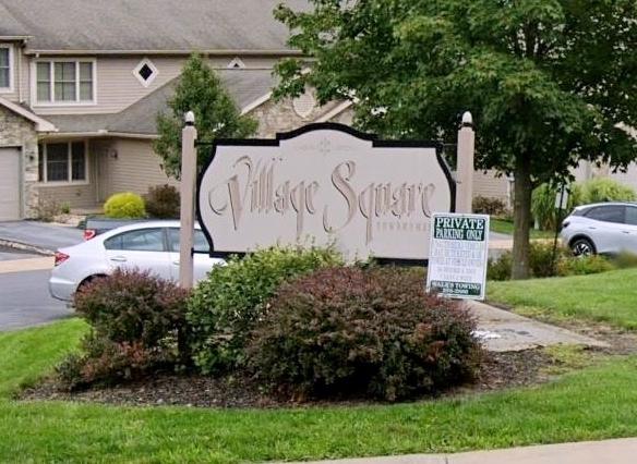 Sign for Village Square condominums