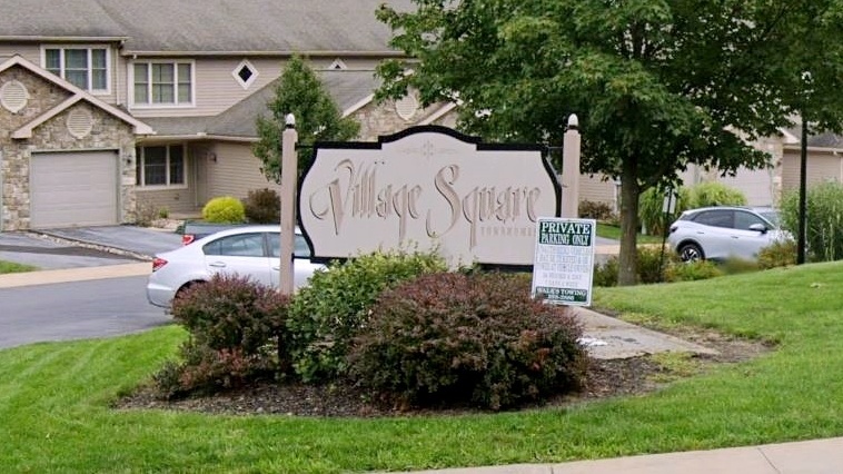 Sign for Village Square condominums