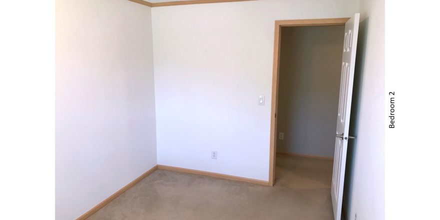 Unfurnished, carpeted bedroom