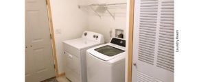 Laundry room with side-by-side top load washer and front load dryer