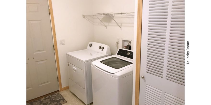 Laundry room with side-by-side top load washer and front load dryer