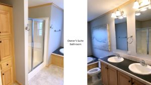 Large bathroom with double vanity, built-in cabinet storage, shower stall, and soaking tub