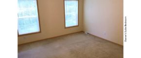 Unfurnished, carpeted bedroom with two windows