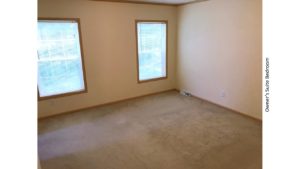 Unfurnished, carpeted bedroom with two windows