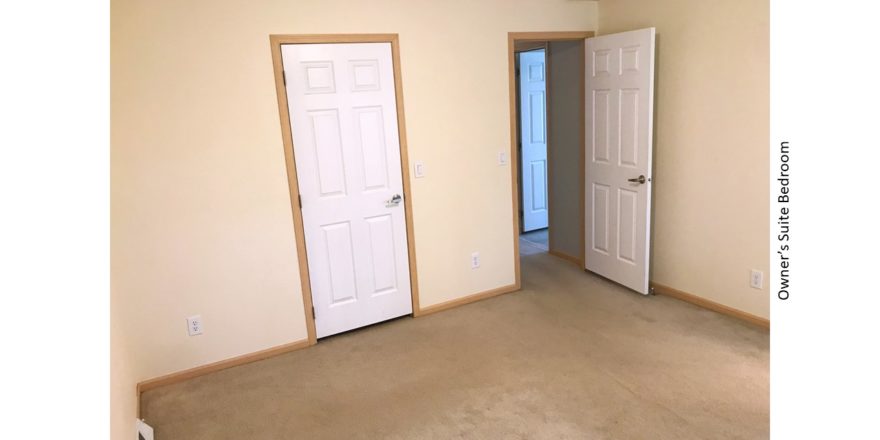 Unfurnished, carpeted bedroom with closet