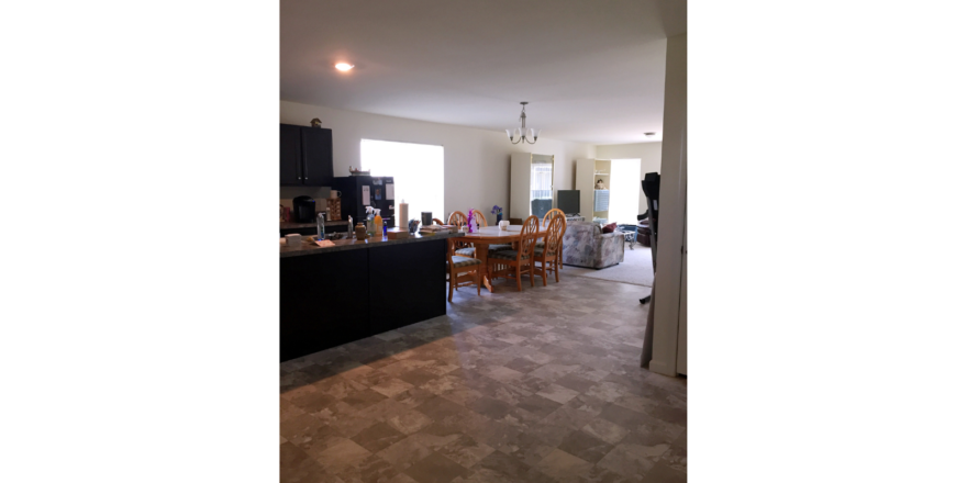 Kitchen with table, and island