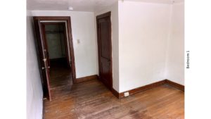 Unfurnished bedroom with hardwood floors, and closet