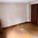 Unfurnished bedroom with hardwood floors and closet