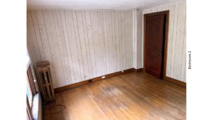 Unfurnished bedroom with hardwood floors and closet