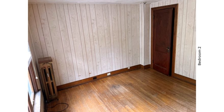 Unfurnished bedroom with hardwood floors and closet