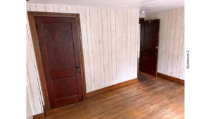 Unfurnished bedroom with hardwood floors and closet