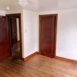 Unfurnished bedroom with hardwood floors and closet