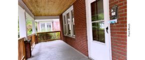 Covered front porch with railing