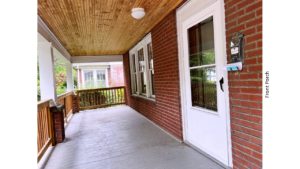 Covered front porch with railing