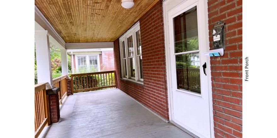 Covered front porch with railing