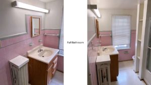 Full bathroom with vanity, medicine cabinet, toilet, shelving, and tub/shower combo