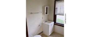 Half bathroom with vanity, toilet, and medicine cabinet