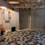 Unfinished basement with children's toys and large rug