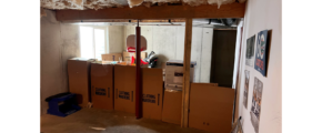 Boxes in an unfinished basement
