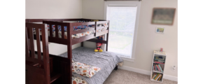 Bedroom with bunk bed and small bookcase