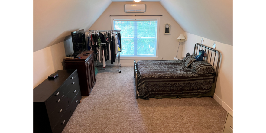 Bonus room set up as a bedroom