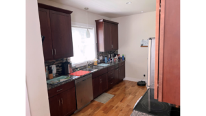 Kitchen with dark wood-tone cabinets and stainless steel appliances