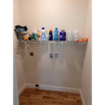Laundry room with hookups and wire shelving