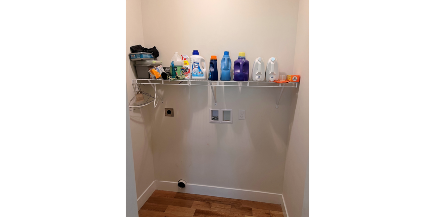 Laundry room with hookups and wire shelving