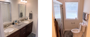 Owner's suite bathroom with double vanity, mirrors, toilet, and shower