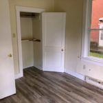 Bedroom with closet and large window