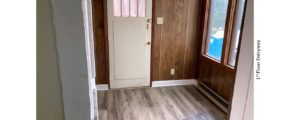 Entryway with large windows and wood paneling
