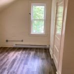 Bedroom with window and closet