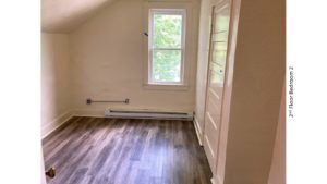 Bedroom with window and closet