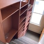 Stairs with built-in shelving on one side