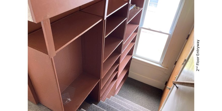 Stairs with built-in shelving on one side