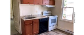 Kitchen with wood-tone cabinets, sink, black dishwasher, and white range oven