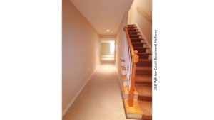 Carpeted hallway and staircase