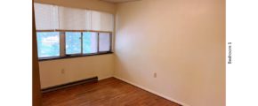 Unfurnished bedroom with hardwood floor