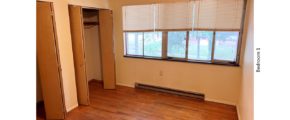 Unfurnished bedroom with hardwood floor