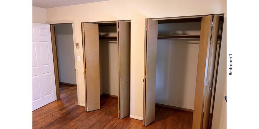 Unfurnished bedroom with hardwood floor