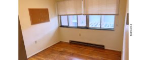 Unfurnished bedroom with hardwood floor