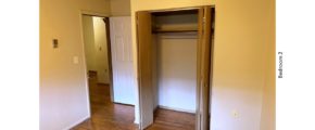 Unfurnished bedroom with hardwood floor