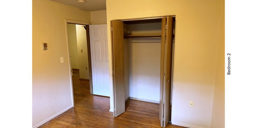 Unfurnished bedroom with hardwood floor