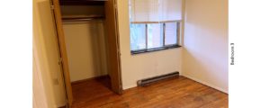Unfurnished bedroom with hardwood floor
