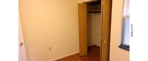 Unfurnished bedroom with hardwood floor