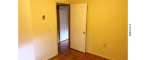 Unfurnished bedroom with hardwood floor