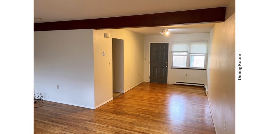 Unfurnished dining room with hardwood floor