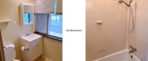 Full bathroom with vanity, medicine cabinet, toilet, shelving, and tub/shower combo